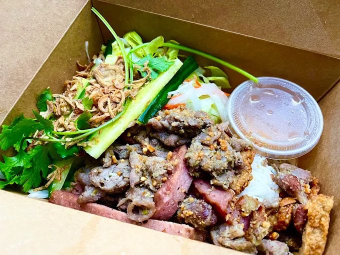 Grilled Chicken Vermicelli Bowl - Fresh rice vermicelli topped with grilled chicken, herbs, vegetables, and Vietnamese dipping sauce